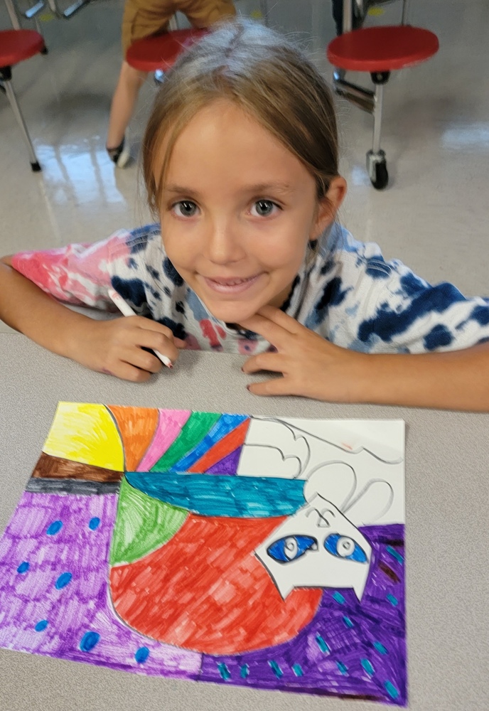 Lauren is completing her artwork inspired by Romero Britto!